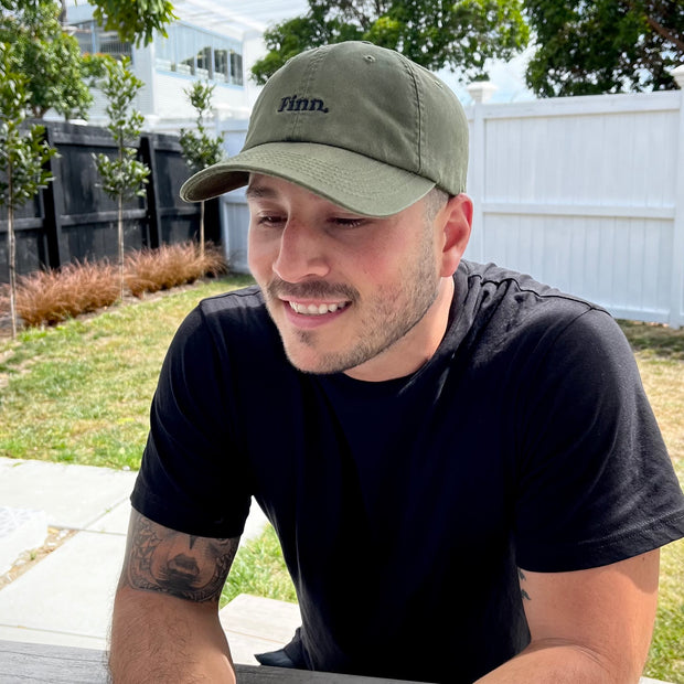 Model at ease in the Olive Green Acts of Leisure Cap