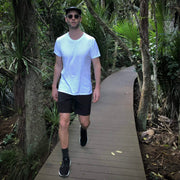 Model wearing Black Always Ready Shorts hiking in bush